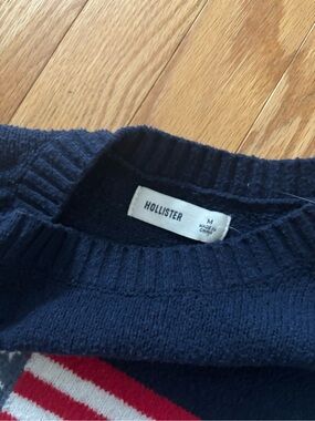 Hollister Men's Dark Blue Crewneck Sweater with Red & White Stripe Detail